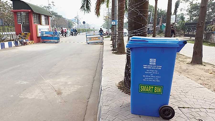 A smart bin placed in front of a park in New Town