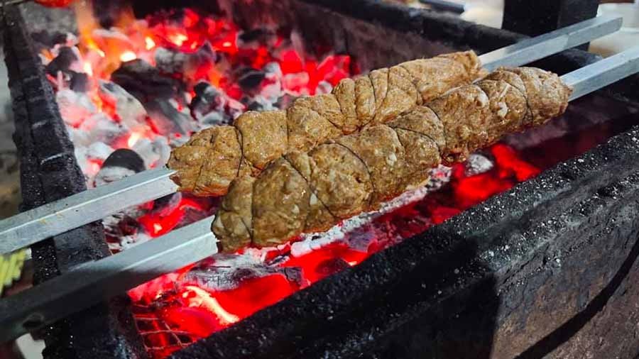 Kebabs on the barbeque at Roasted Cart near Bosepukur, Kasba 