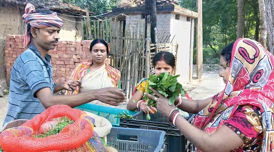 Bhuban Das sells vegetables in Murshidabad's Samserganj. 