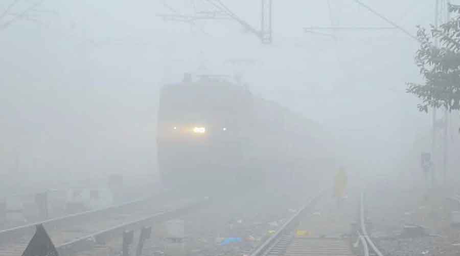 A train approaches a railway station in Ranchi  on Monday.