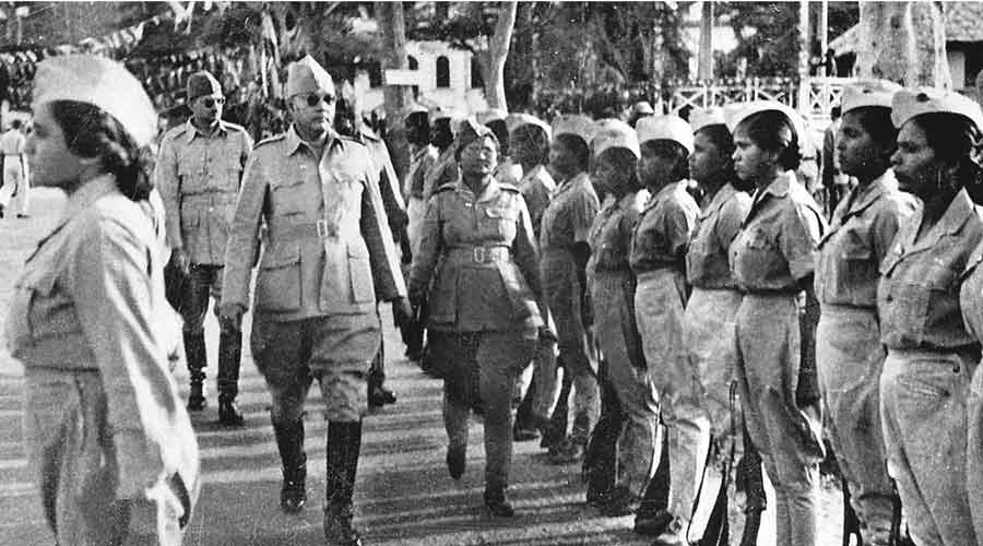 Netaji  receiving the guard of honour from the  Rani of Jhansi Regiment of the INA.