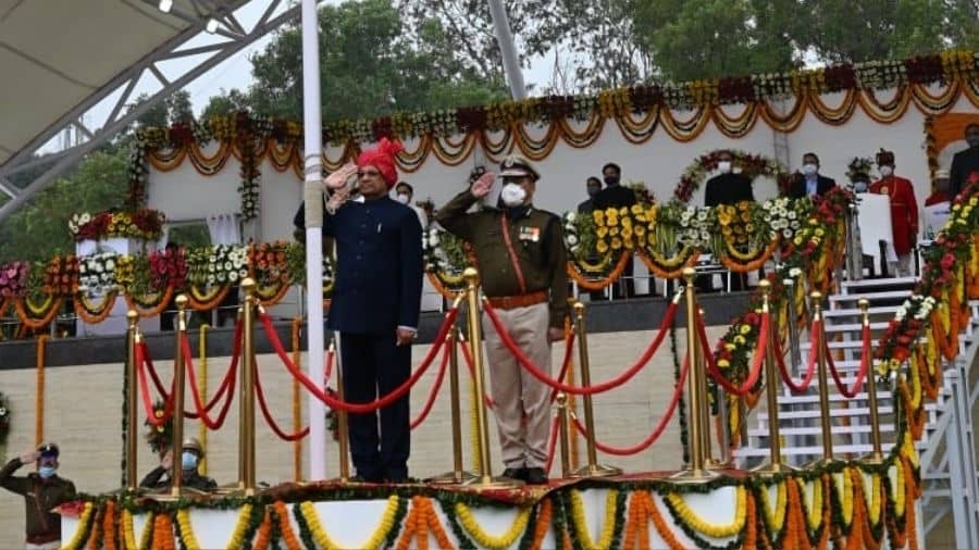 Governor Ramesh Bais salutes the flag after unfurling it, in Ranchi. 