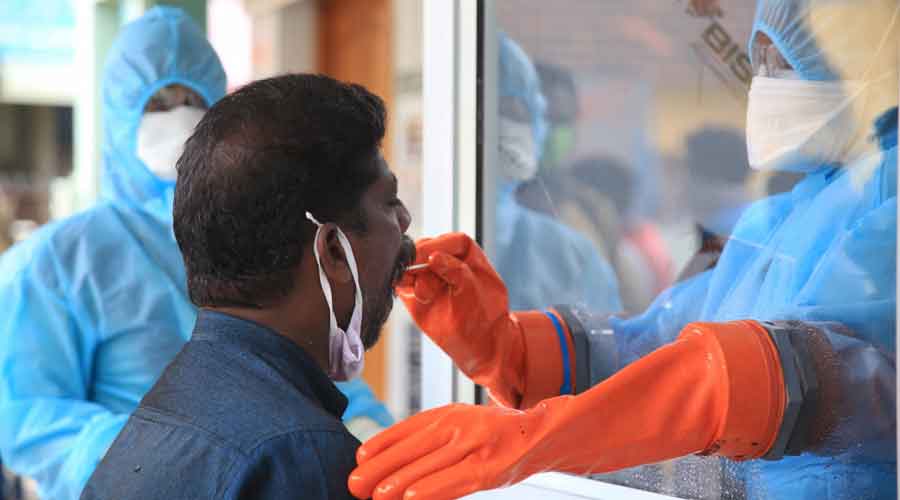 A man gets tested for Covid-19. The number of Covid deaths in Kolkata does not mirror the decline in cases