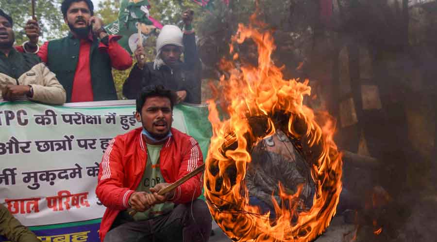 Jan Adhikar Party activists burn tyres to block a road during the Bihar bandh called by students over alleged discrepancies in Railway Recruitment Boards Non-Technical Popular Categories exam, in Patna on Friday.