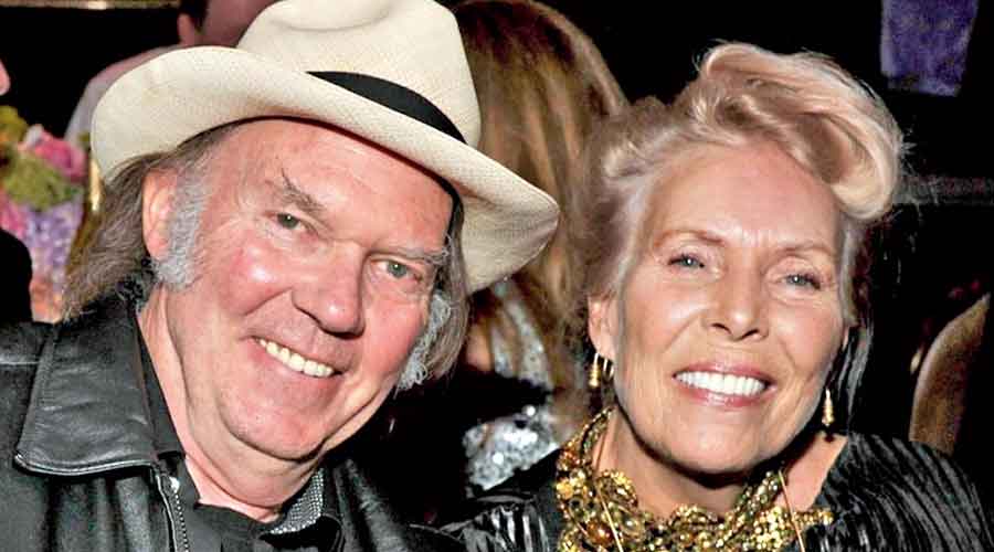 A file picture shows Neil Young and Joni Mitchell.