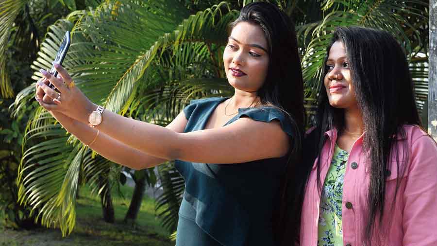 Two women were taking a selfie. They had come to New Town for a video shoot, they said. “We are doing a video shoot and so not wearing masks,” said the one with the phone.