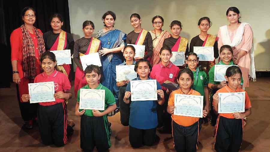 Students display their certificates at the end of the day’s events