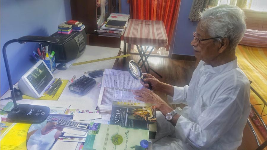Nirendra Nath Das Sarma, 103 years old, working at his desk