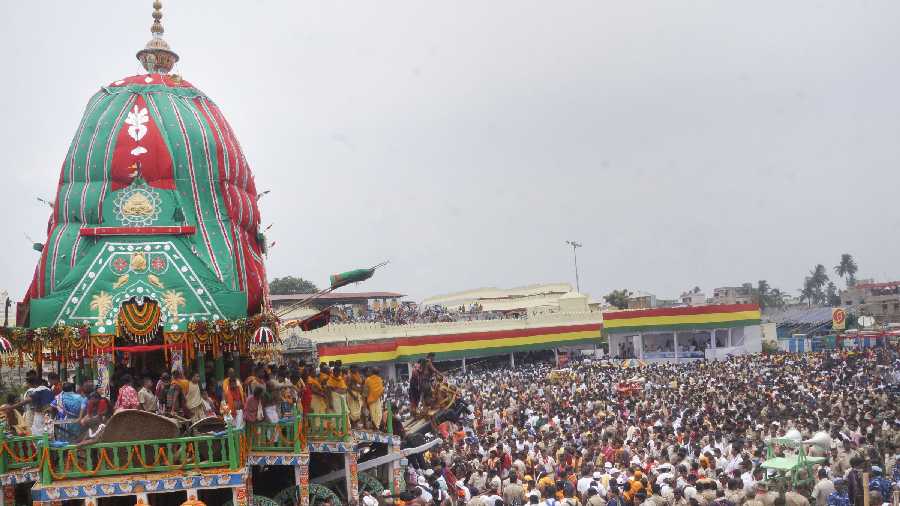 Devotees attend the annual Rath Yatra of Lord Jagannath which commenced amid tight security in Puri