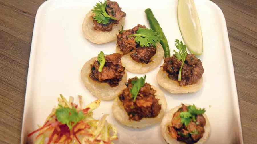 Pop these delicious Dahi Puchkas in your mouth. These are stuffed with mouth-watering spicy aloo filling and sweet yoghurt.