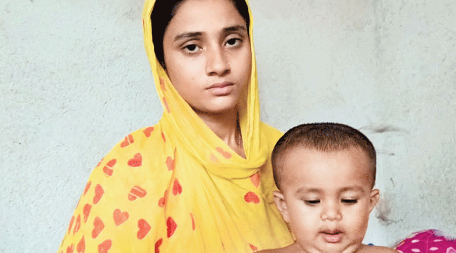 Ahmed’s wife Rimana Yasmin her son at their home in Basirhat on Friday.