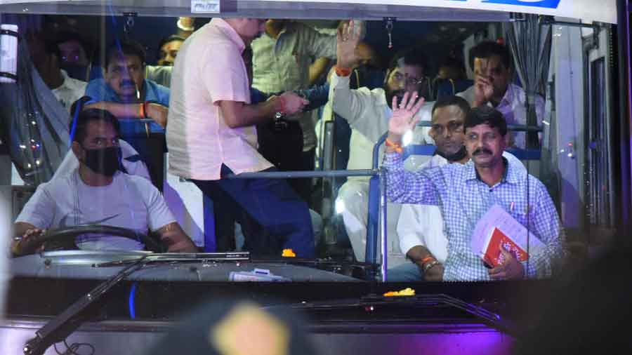 Maharashtra CM Eknath Shinde and rebel Shiv Sena MLAs leave from the airport in a bus, after arriving in Mumbai on Saturday