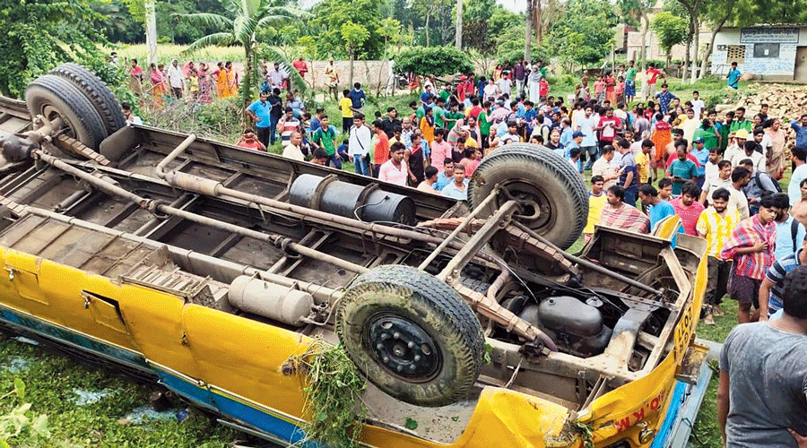 The school bus that overturned in Malda  on Saturday.