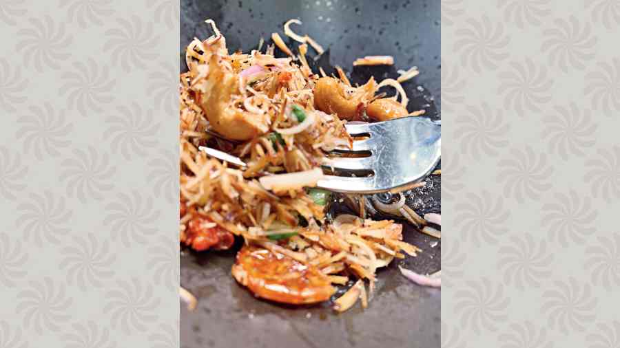 Toasted coconut salad shavings + lemongrass + sakura ebi (shrimp) that is dried + shallots + Thai-inspired citrusy sauce at Southside Interim Market, Sentosa