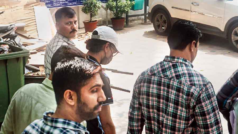 Mohammed Zubair (in cap) being produced in the Delhi court on Saturday