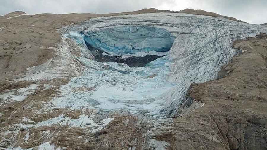 A large chunk of glacier broke off near the Marmolada peak in the Italian Alps, sending ice and rock careening down onto a popular hiking trail