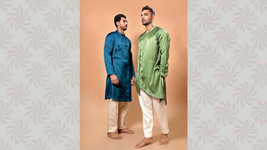 Soft and easy on the skin, these green satin draped asymmetric kurtas are ideal for mehndi or any day event. The silk kurtas are available in various other shades.