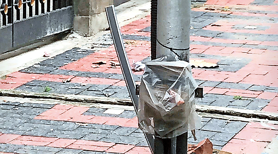 The junction box of an electric pole covered with  a plastic bag in Salt Lake’s Sector I.