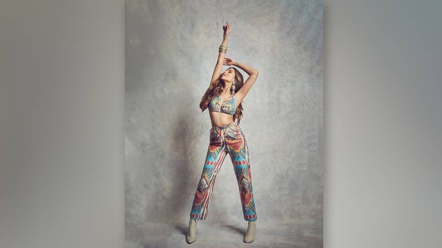 Tara Sutaria, who started her Bollywood career with Student of The Year 2, aces co-ord fashion with elan in an ikat number by the label The Ikat Story. Teamed with boots and statement earrings, this summer look is perfect for a party.