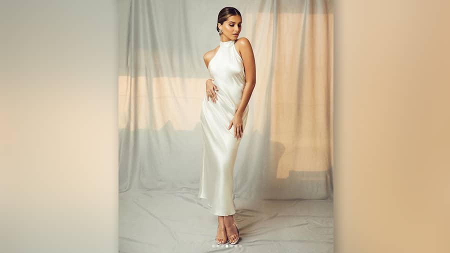 Not just a graceful dancer, Tara Sutaria is a trained singer too. The ‘Ek Villain Returns’ actress channels her inner diva in this white satin halter.