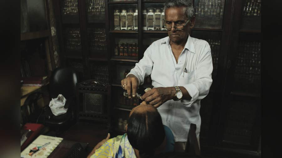 Dr Mrinal Kanti Ghosh tends to a patient