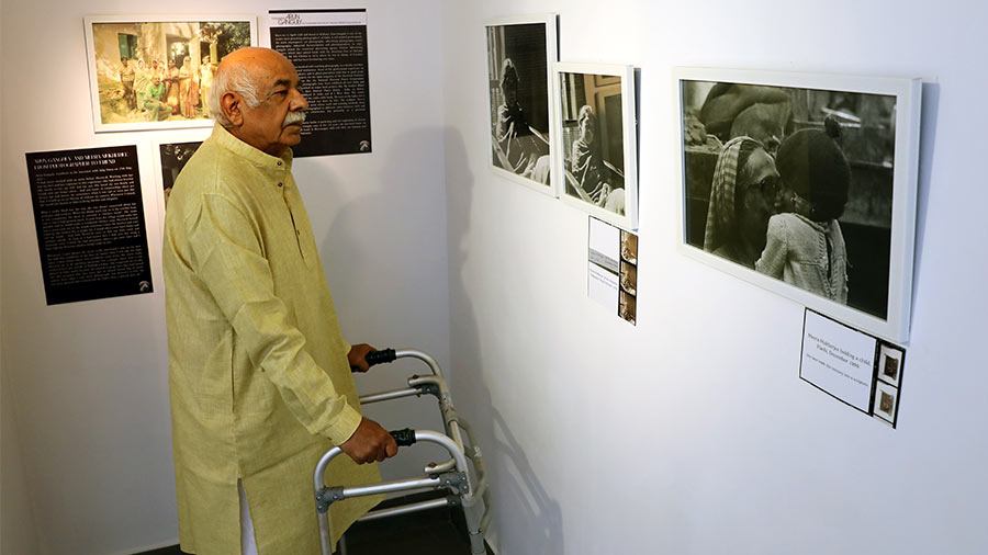 Arun Ganguly looks at the photographs.