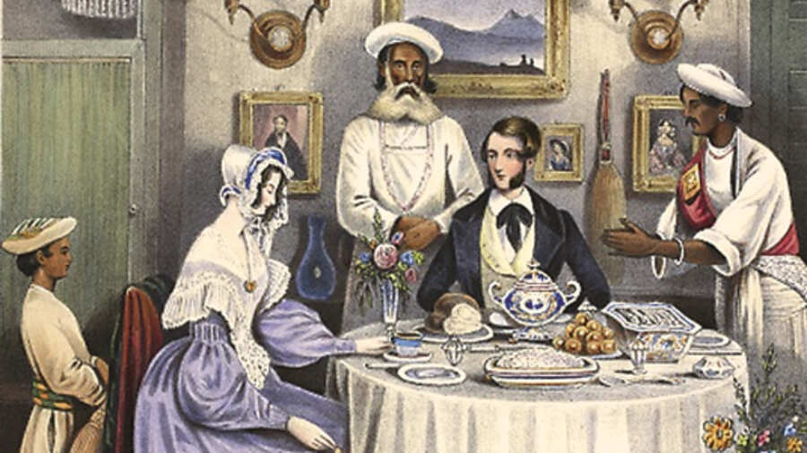 The Breakfast. A young married couple having a meal with servants in attendance. Lithograph by J. Bouvier. Sketches illustrating the manner and customs of the Indians and the Anglo-Indians. London, Thomas McLean, 1842.