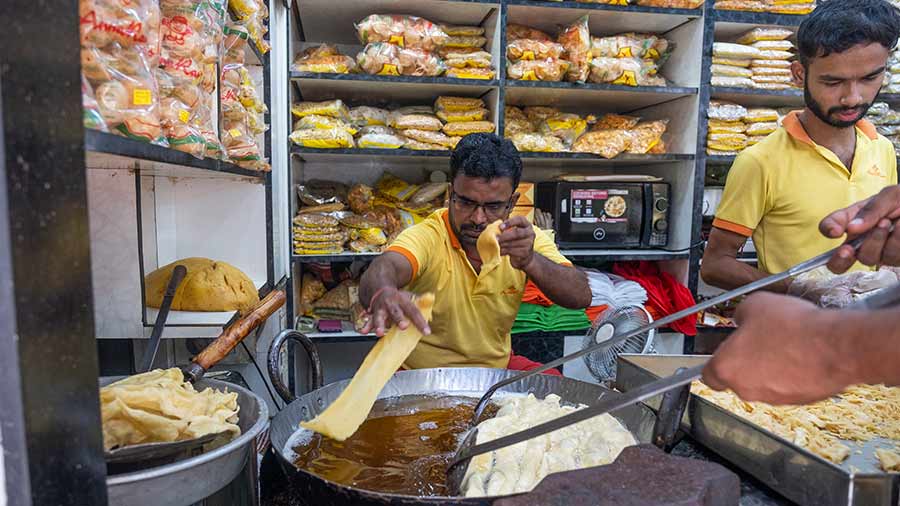 A staff member makes fafda 