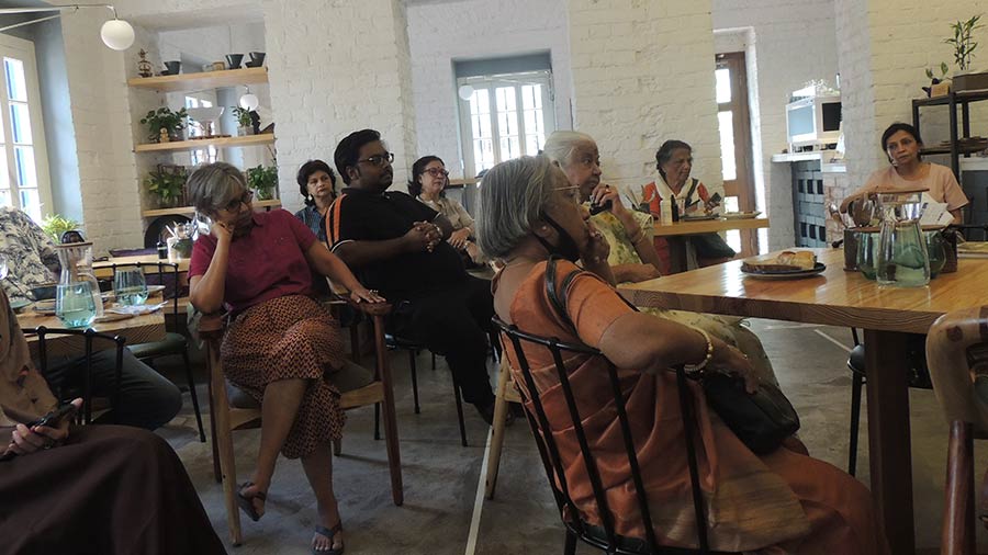 The audience at the book club listens with rapt attention.