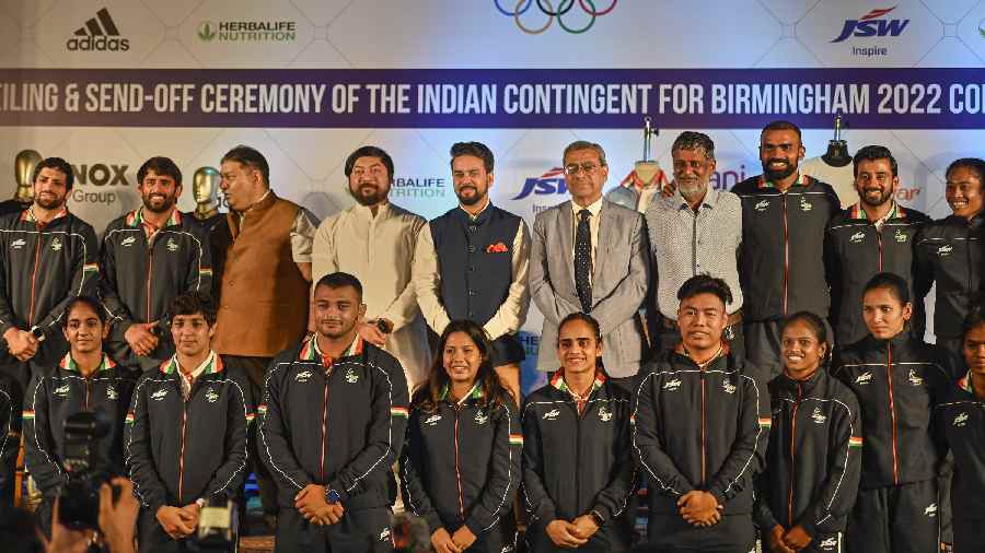  Union Sports Minister Anurag Thakur with Indian contingent during the kit unveiling and send-off ceremony