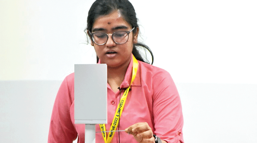 Diya Ghosh demonstrates her multi-tasking agricultural kit prototype.