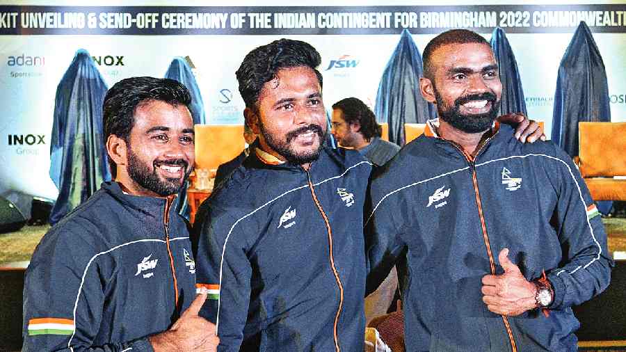 Indian hockey players (from left) Manpreet Singh, Harmanpreet Singh and PR Sreejesh during the kit unveiling and send-off ceremony for the Commonwealth Games in New Delhi on Thursday. 