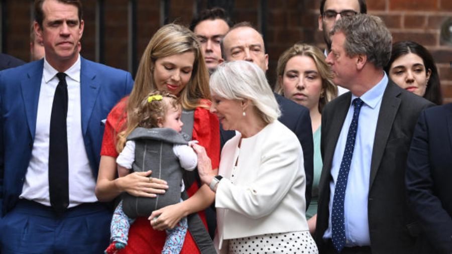 Carrie Johnson with her baby daughter Romy as Boris Johnson announces his resignation at 10 Downing Street on Thursday