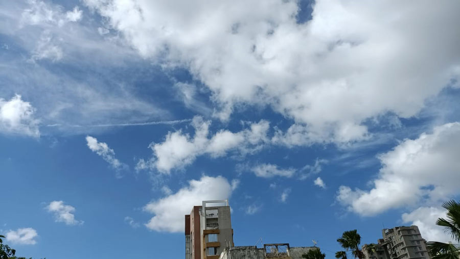 Wispy cotton clouds hover over a south Kolkata neighbourhood on Thursday, July 7.