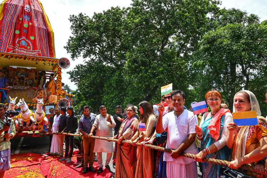 Ukrainian and Russian citizens participate in ISKCON's 'Ulta Rath' procession on Park Street on Saturday, July 9. The procession began near the Park Street Metro station and ended at the ISKCON temple on Albert Road.