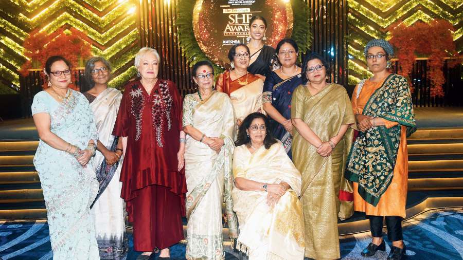 The winners of The Telegraph SHE Awards 2022 — (standing, l-r) Jyotirmoyee Sikdar (Sports), Moushumi Bhowmik (Music), June Tomkyns (Lifestyle Entrepreneur), Sohag Sen (Theatre), Mamata Shankar (Dance), Paoli Dam (Film), Sanghamitra Bandyopadhyay (Education), Baisakhi Ghosh (Creative Art), Mandakranta Sen (Literature); and (seated) Arati Mukhopadhyay (Hall of Fame).