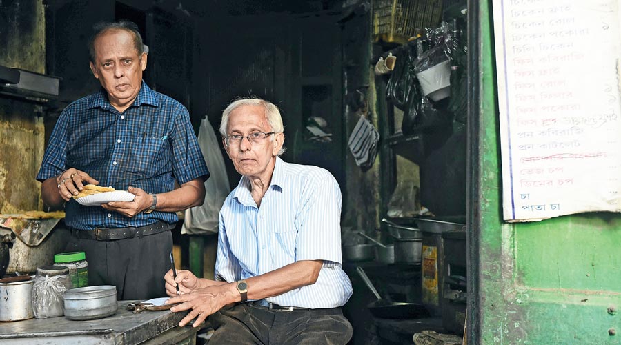 Mohadeb Mukherjee and (right) Apurba Mukherjee at their  shop in Kidderpore. 