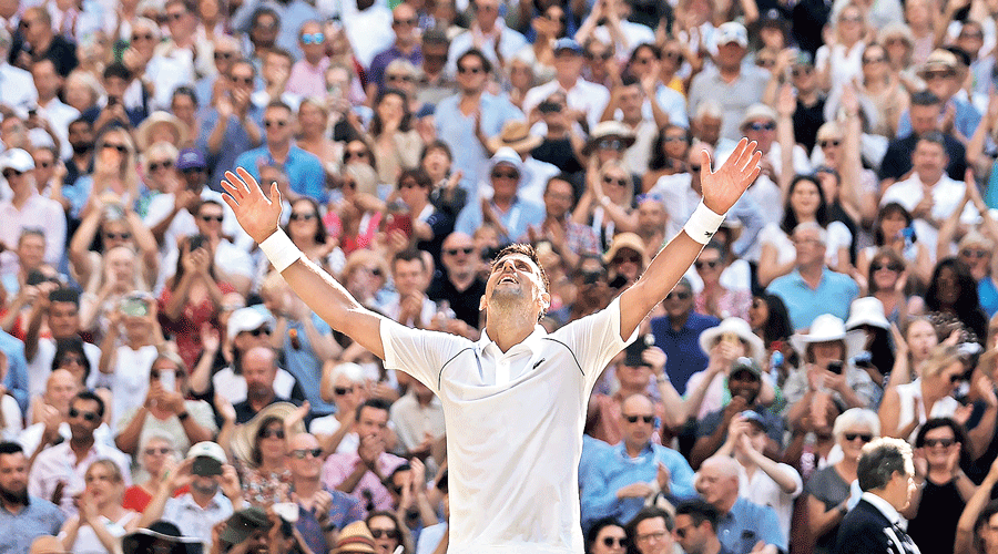 Novak Djokovic in a celebratory mood after winning his seventh Wimbledon title,  defeating Nick Kyrgios in four sets on  Sunday.