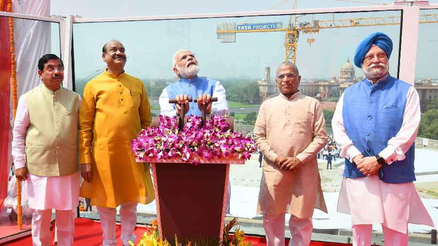 Prime Minister Narendra Modi unveils a bronze national emblem at new Parliament building in New Delhi on Monday