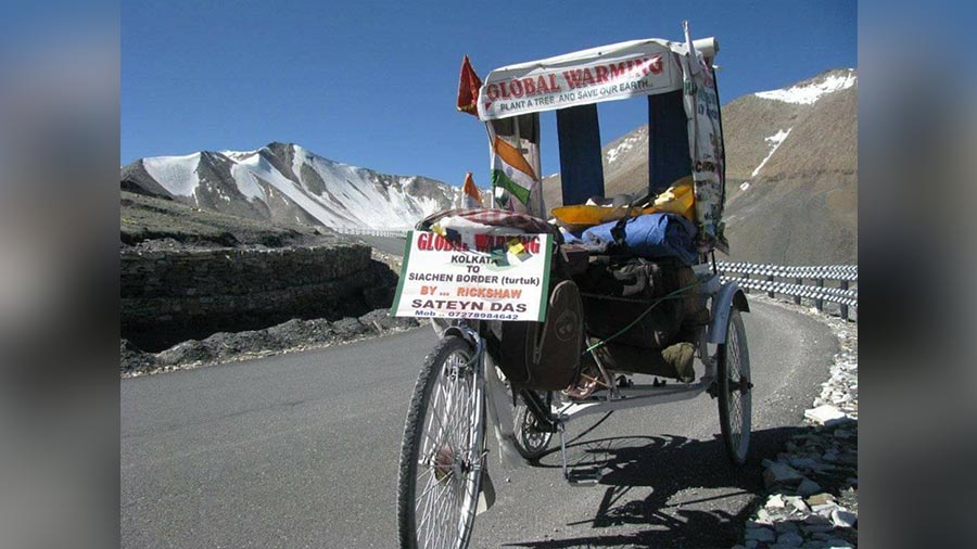 The battery-operated rickshaw has special brakes that allows Satyen Das to travel uphill