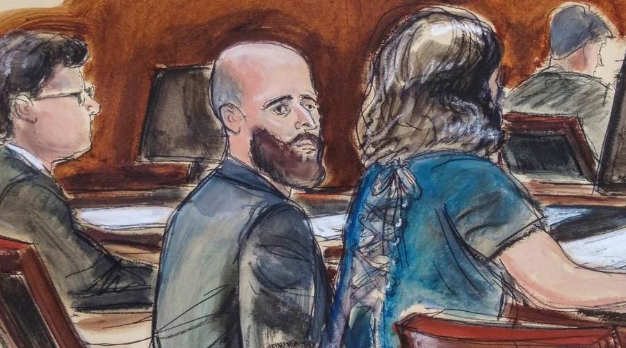 A courtroom sketch shows Joshua Schulte, center, seated at the defense table during jury deliberations.