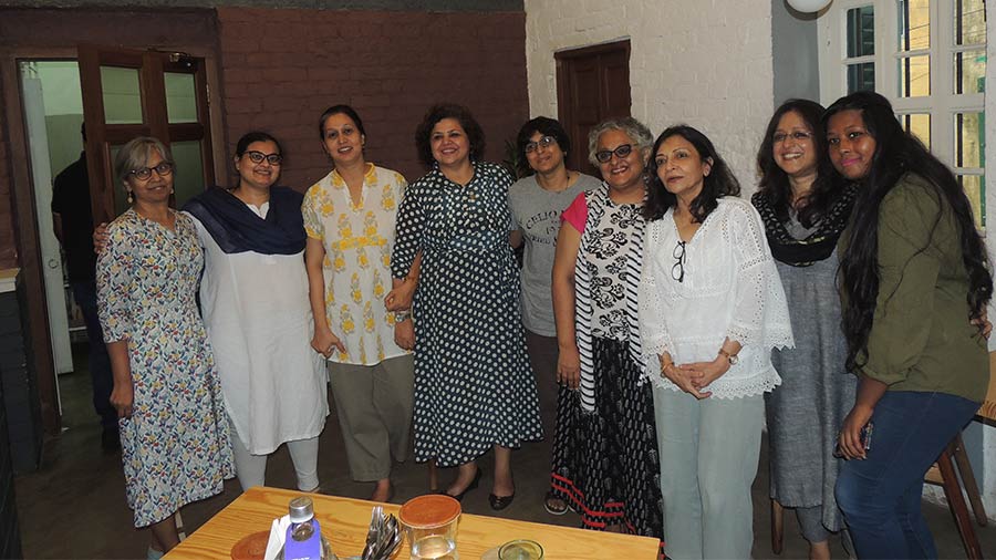 Participants at the cafe with Ranjini Guha.