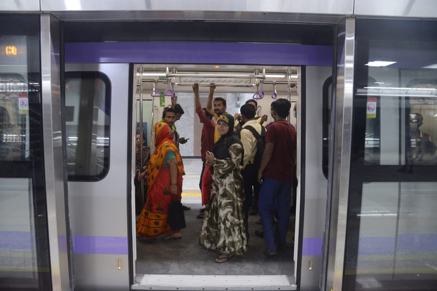 Commuters board a train at Sealdah Metro station, which opened its doors to the public on Thursday. The newest addition to the East-West Metro corridor will help passengers commute from Sealdah to Sector V, Salt Lake. The highest fare on this route has been set at Rs 20 and the lowest at Rs 10.
