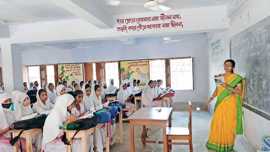 A teacher takes a Class XI lesson at Debkunda Sk Abdur Razzak Memorial Girls High Madarsah in Murshidabad.