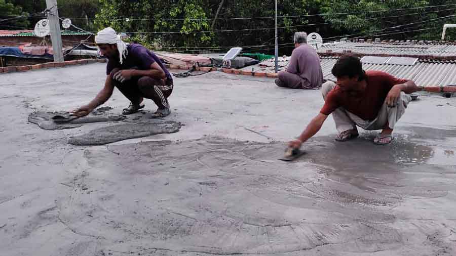 Workers doing some repair work at Majnu ka Tila