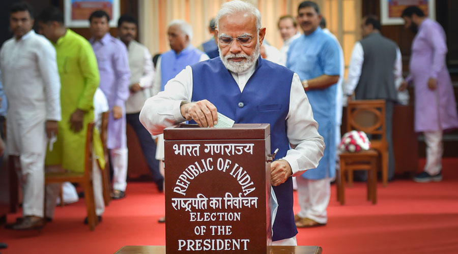 Prime Minister Narendra Modi casts his vote for the election of the President, at Parliament House in New Delhi