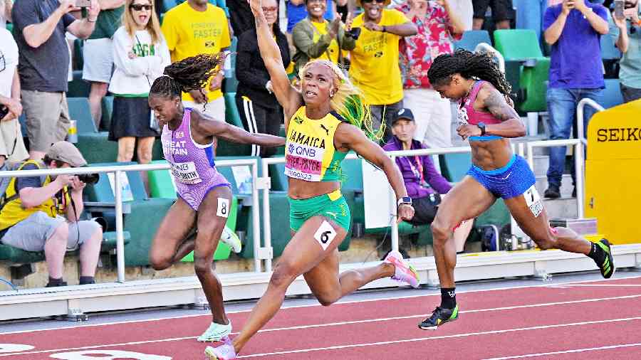 Jamaica’s Shelly-Ann Fraser-Pryce (centre) crosses the line to win the women’s 100 metres final at the Hayward Field in Eugene on Sunday. 
