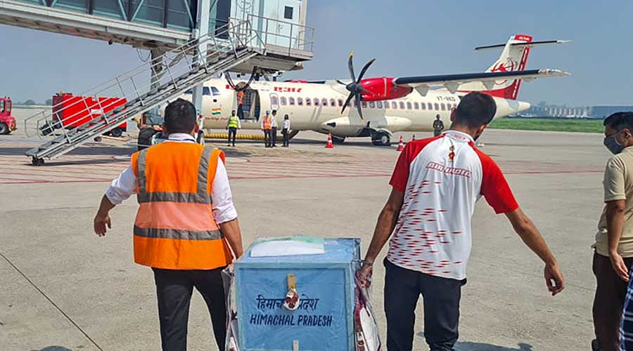 A ballot box carrying votes cast by the lawmakers in the presidential election in the state of Himachal Pradesh being taken to a Delhi-bound flight, at the airport in Chandigarh.