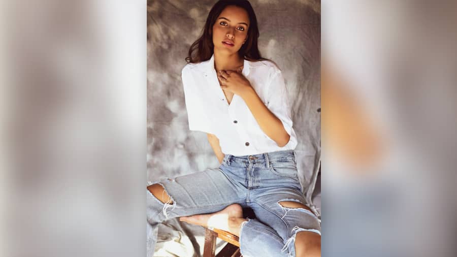 The actress, who will also be seen in ‘Animal’ with Ranbir Kapoor, slays it in this classic ripped denim-white shirt combo.