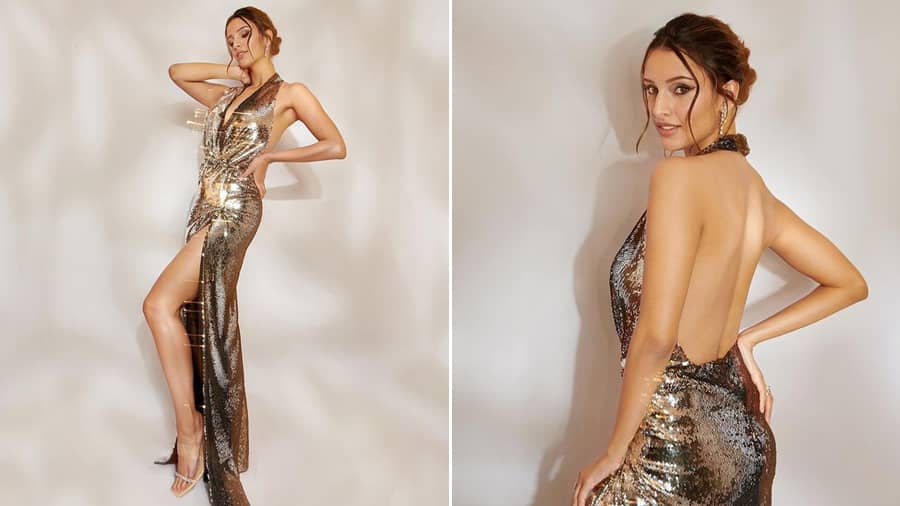 In a thigh-high slit, halter-neck sequin gown by Nykaa Fashion X Nikhil Thampi outfit, sleek earrings, soft smoky eyes and messy bun, the 28-year-old actress, who will be next seen in the film 'Rola' with Vicky Kaushal, is all set to rock and roll.